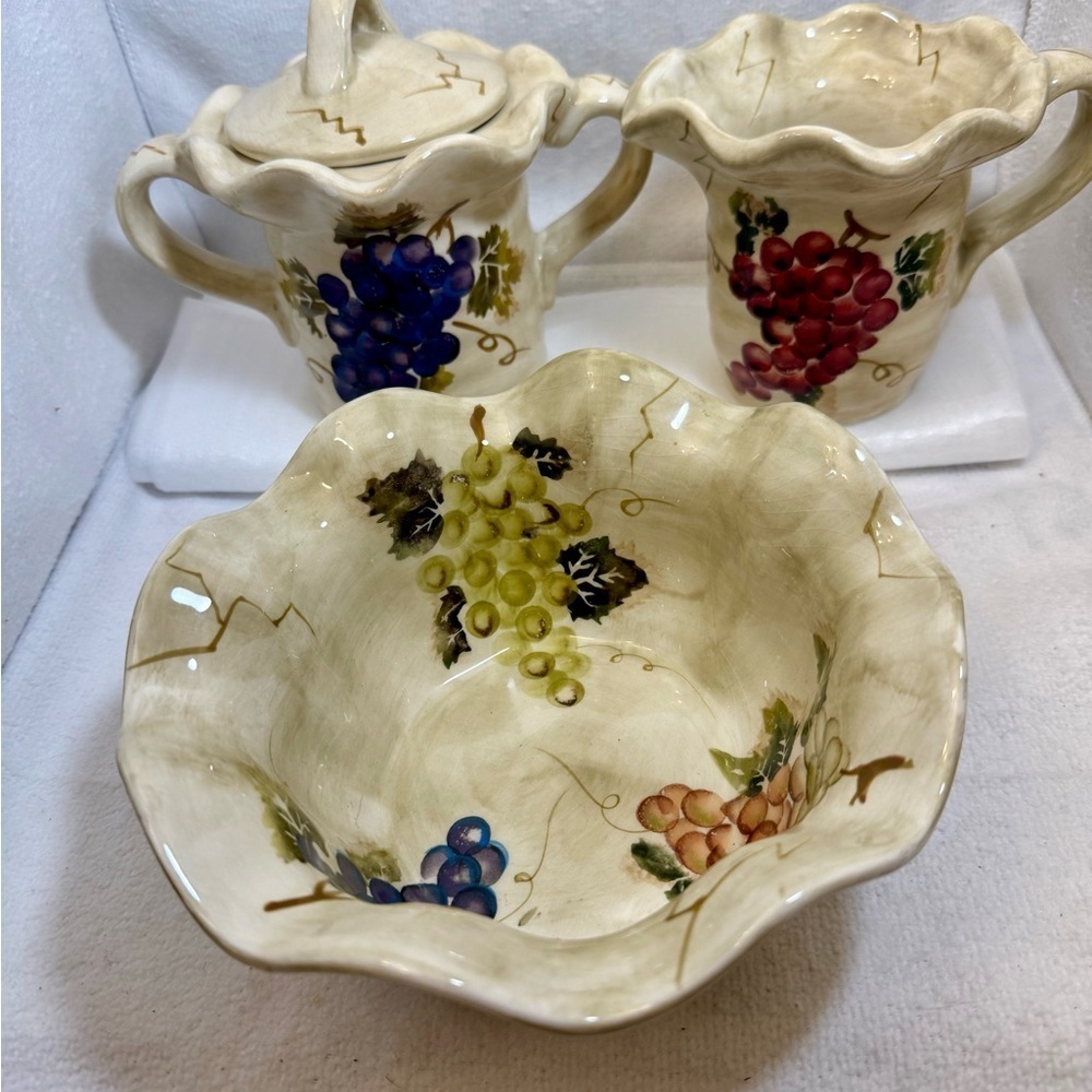 Three-piece set of Tabletops Unlimited 'Cabernet' pattern serving pieces.